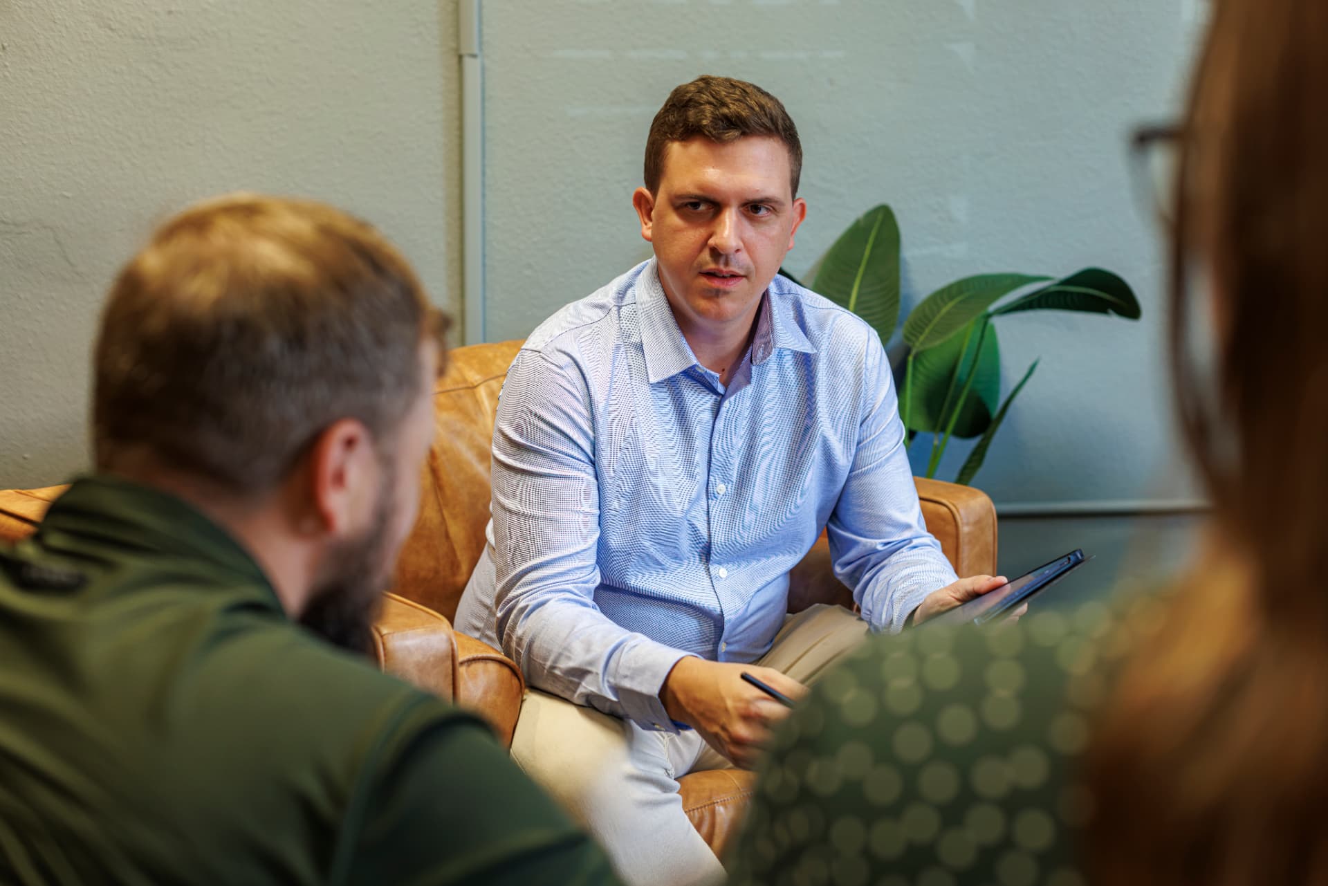 Kyle Hope counseling a couple in his San Marcos office